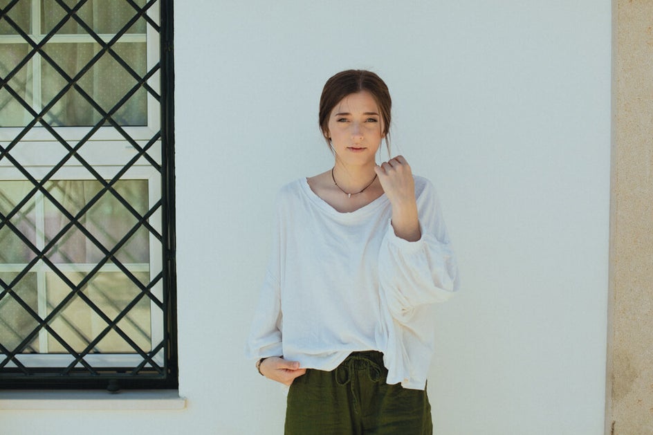 girl in front of wall